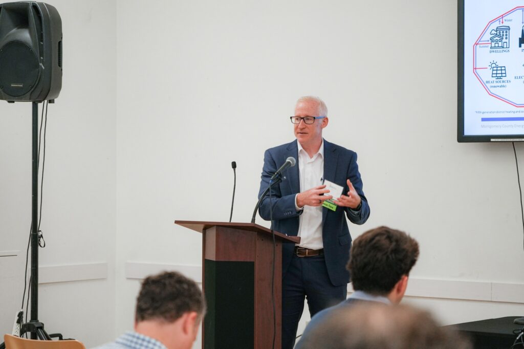 FVB’s Ben Burgoyne presenting at a conference podium.