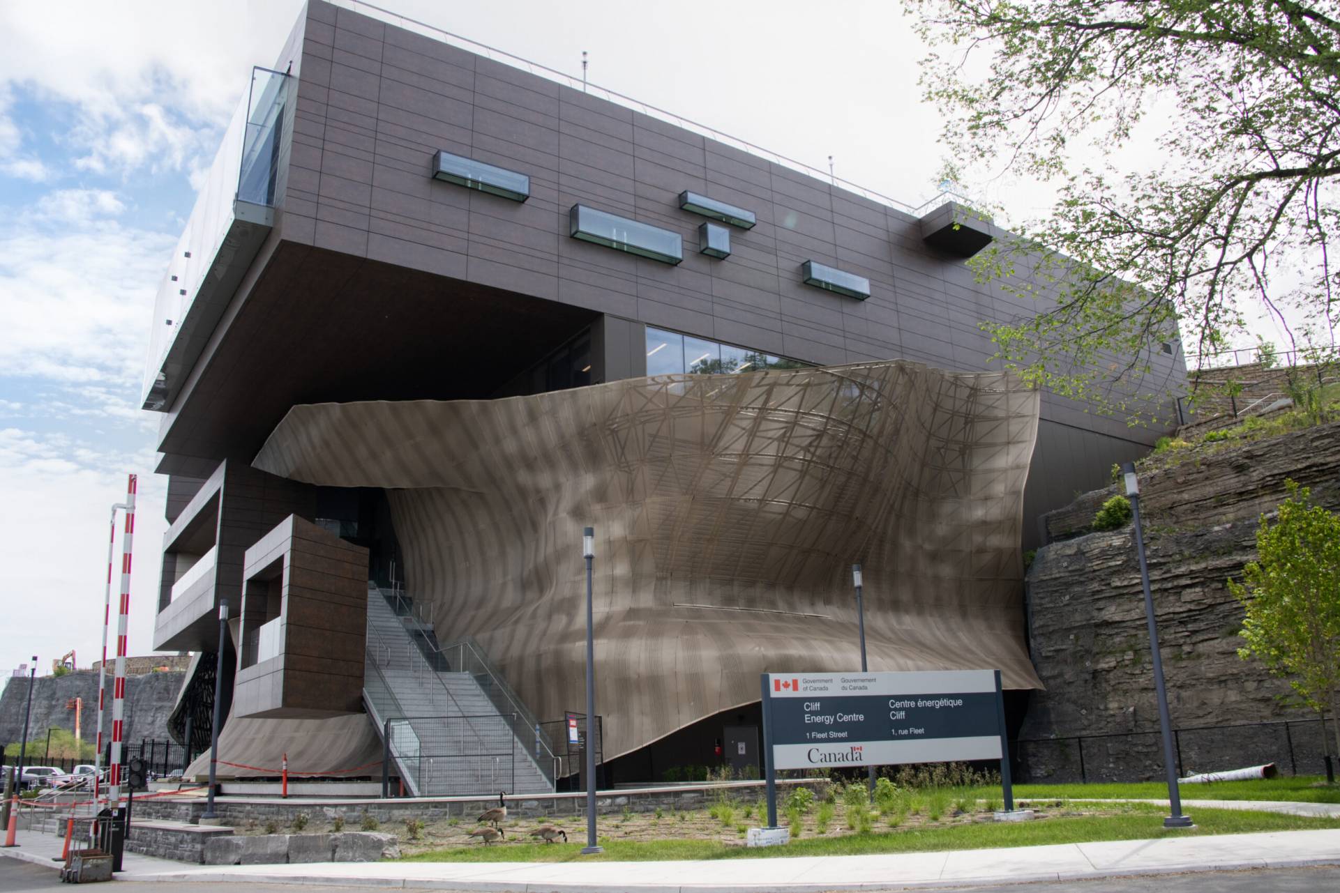 Cliff District Energy Centre building with flowing metal exterior at cliffside